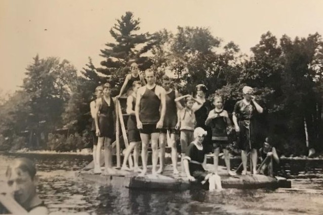 historic picture of swimmers on a swim dock