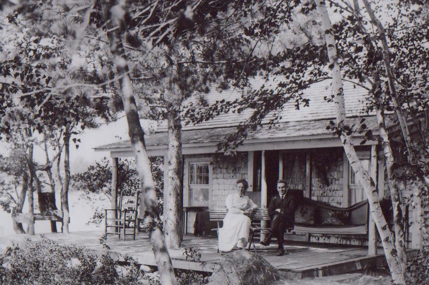historic picture of guests on a cabin deck
