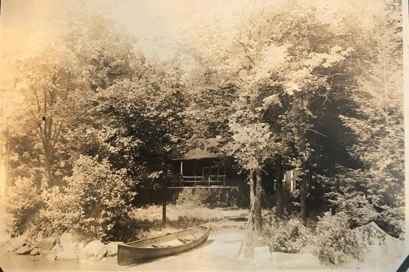 historic picture of a cabin on Taconnet